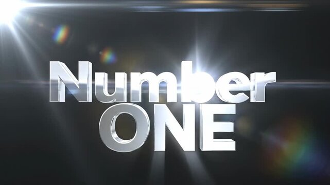A silver 'Number One' text graphic on a dark background with lens flares