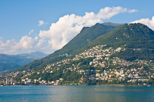 Monte Bre and Lugano cityscape by Lake Lugano Switzerland