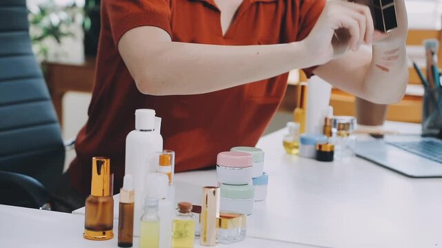 Asian woman beauty Vlogger live broadcasting cosmetic makeup tutorial sharing on social media. Business online influencer on social media concept. Online Selling. Online Shopping.