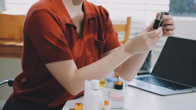 Asian woman beauty Vlogger live broadcasting cosmetic makeup tutorial sharing on social media. Business online influencer on social media concept. Online Selling. Online Shopping.