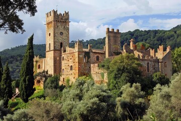 Scenic view of a historic castle nestled in the tuscan countryside, showcasing its architectural grandeur and serene surroundings