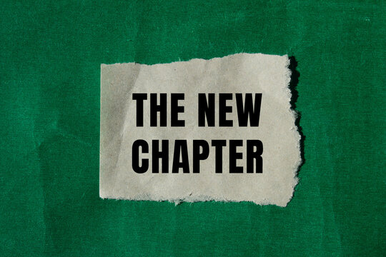 The new chapter message written on ripped torn paper background. Conceptual The new chapter symbol. Copy space.