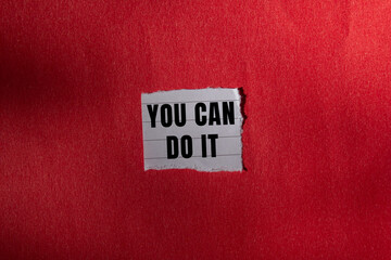 You Can Do It message written on ripped torn paper background. Conceptual You Can Do It symbol. Copy space.