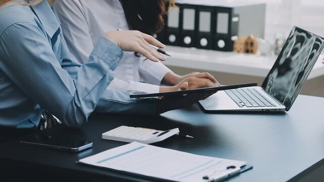 Human use calculator and calculate bills and paying bill, credit card, tax and vat, payment, concept of money management and business report with financial documents, financial accounting concept