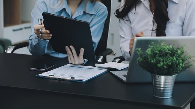 Human use calculator and calculate bills and paying bill, credit card, tax and vat, payment, concept of money management and business report with financial documents, financial accounting concept