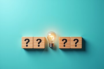A glowing light bulb sits between four wooden blocks, each marked with a question mark  symbolizing the moment of insight or solution to an unknown problem.