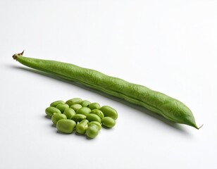 Fresh green bean pod with shelled beans against a white backdrop