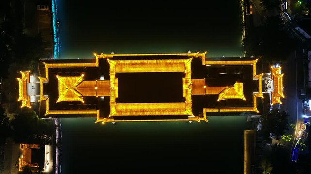 Top View Of Anshun Bridge Spanning Jin River At Night In The City Of Chengdu, Sichuan Province, China. Aerial Shot