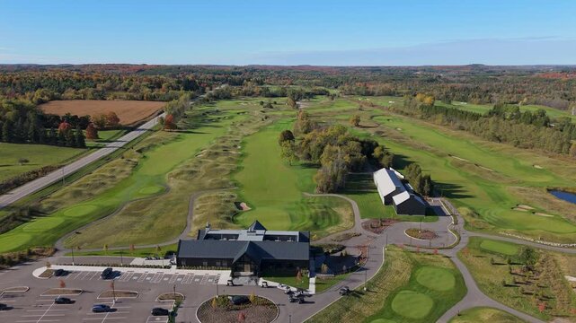 Aerial Flyover Of A Fairway And Clubhouse At TPC Toronto Osprey Valley Golf Course During Fall In Caledon, Ontario.