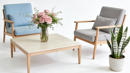 Modern living room setup with two armchairs, a coffee table, floral arrangement, and potted plant