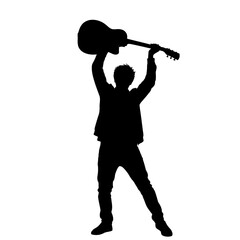 Silhouette of a person triumphantly raising a guitar overhead
