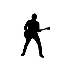 Silhouette of a musician playing an electric guitar in a dynamic pose