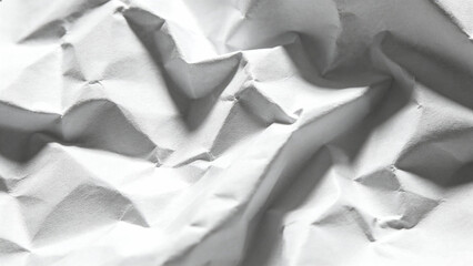 Abstract texture of crumpled white paper with intricate folds and shadows