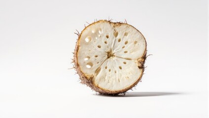 Sliced Tropical Fruit Cross Section with Seeds on White Background.