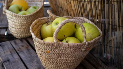 Fotobehang Keuken Two woven baskets filled with green apples.  © Outsiderzone