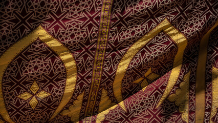 Intricate fabric with geometric patterns and rich colors.