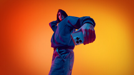 Man interacting with smartphone for digital services. Concept of productivity app advertising, fintech and service platforms, mobile solutions promotion, and business software marketing.