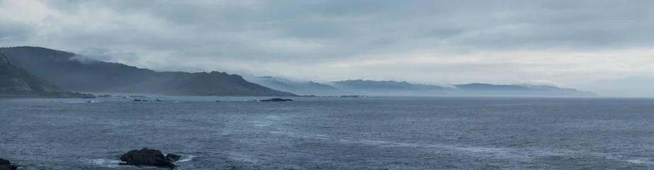 Overcast Coastal Landscape with Misty Mountains © F.C.G.