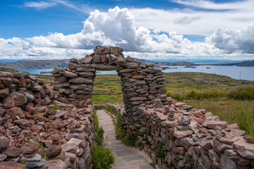 Stone pathway and arch at Pachatata archaeological site, Amantani Island, La ke Titicaca, Peru
