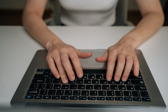 Cropped shot of female hands typing on laptop keyboard, working remotely from home, connecting online, processing data, coding, managing business, browsing internet, digital communication. - Powered by Adobe