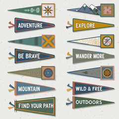 A collection of colorful vintage style pennant flags with inspiring outdoor themes © Juel