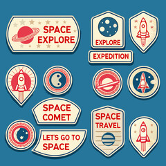 Collection of colorful space exploration badges and emblems featuring rockets and planets © Juel
