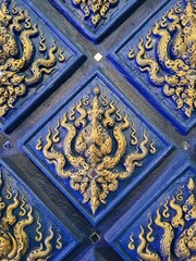 Intricate Stone Carving of Swirling Waves and Ocean Motifs