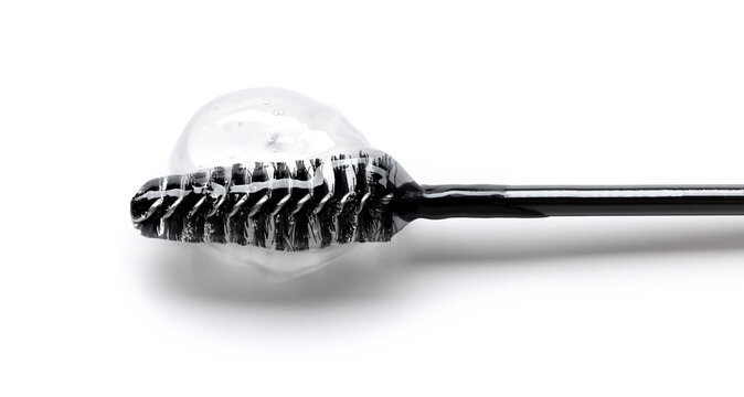 Essence serum gel for eyebrows and eyelashes on a brush