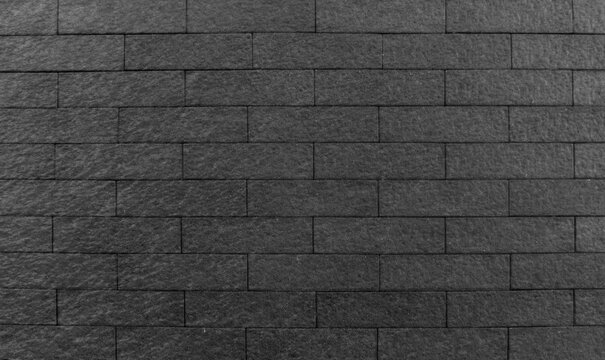 black brick black,  dark grey stone wall,  asphalt pedestrian road flooring background