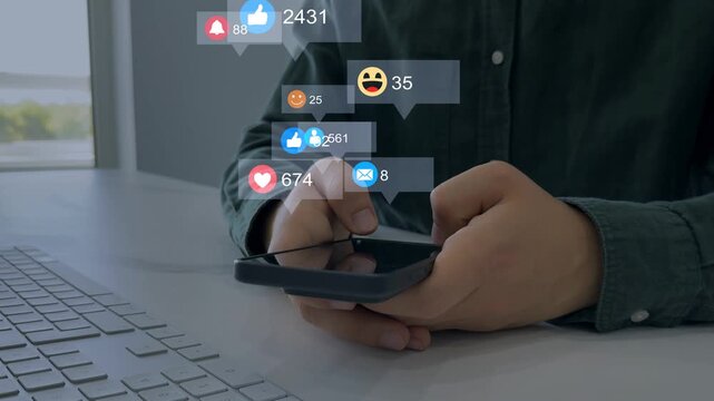 Interactive with friends on chat with emoticon feedback.Person using smart phone with emoticon icons of Social Media.Social media,marketing, like,social network,blog,live,chat reaction and livestream.