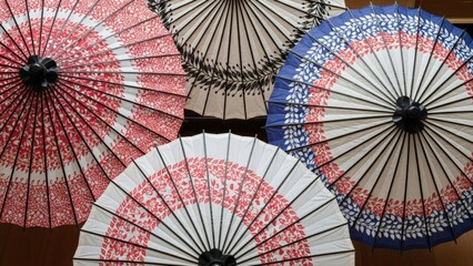 Traditional Japanese paper umbrellas with floral patterns