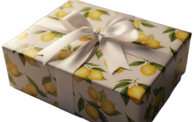 Wrapped gift box with lemon pattern and white satin ribbon bow