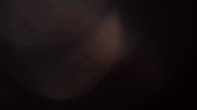 glare of light in the lens on a black background	