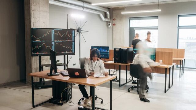 Timelapse of group of people that are working in the modern office together.