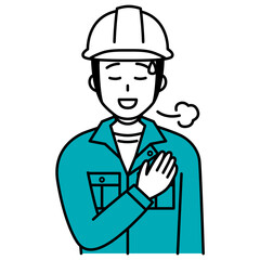 Obraz premium 胸に手を当ててホッとする作業員の男性