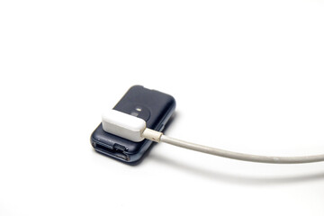 smart watch being charged, isolated on white background