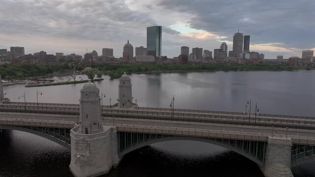Aerial view of the Longfellow Bridge over the Charles River, with Boston's skyline in the background, casting shadows on the water, Boston, Massachusetts, United States.