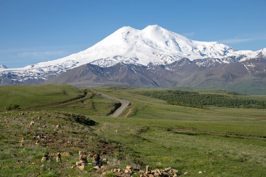 Elbrus in the morning haze. The Republic of Kabardino-Balkaria. North Caucasus, Russia