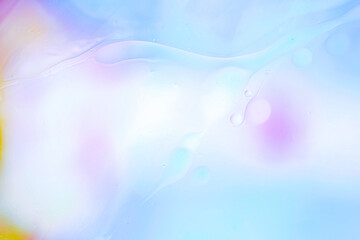 Pastel-toned liquid abstract photographed in macro with gentle light and flowing shapes. Perfect for beauty concepts, skincare visuals, wellness branding, and elegant backgrounds. Copy space
