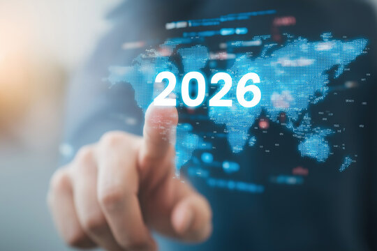 Finger activates holographic 2026 above global map and data visualization screens. - Powered by Adobe