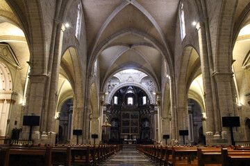 Fototapeta premium Interior of Valencia Cathedral with dome and altar, featuring historic Gothic and Baroque religious architecture, taken in July 2024.