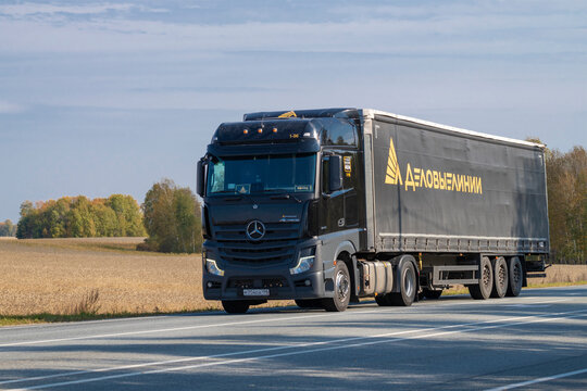 OMSK REGION, RUSSIA - SEPTEMBER 21, 2025: Mercedes-Benz Actros 1845 truck of the Business Lines transport and logistics company on the R-255 Siberia highway on a September afternoon