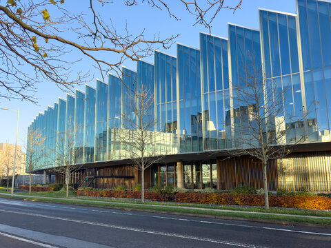 Cambridge, England - December 03, 2025: AstraZeneca global headquarters in Cambridge featuring a striking modern glass facade, architecture and an innovation-driven corporate environment.