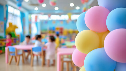 Colorful pastel balloons in decorated kindergarten with children playing in blurred background, festive atmosphere in bright and cheerful classroom with soft lighting. Selective focus.
