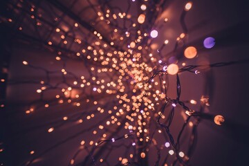 Golden light particles exploding in abstract motion blur background with vibrant orange and purple hues