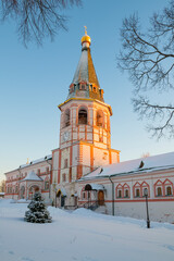 The ancient bell tower of the Valdaisky Iversky Monastery on a sunny January evening. Novgorod region, Russia