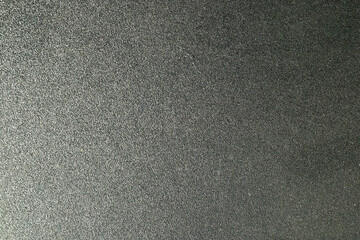 Fototapeta premium Close up of a textured black leather or synthetic material surface