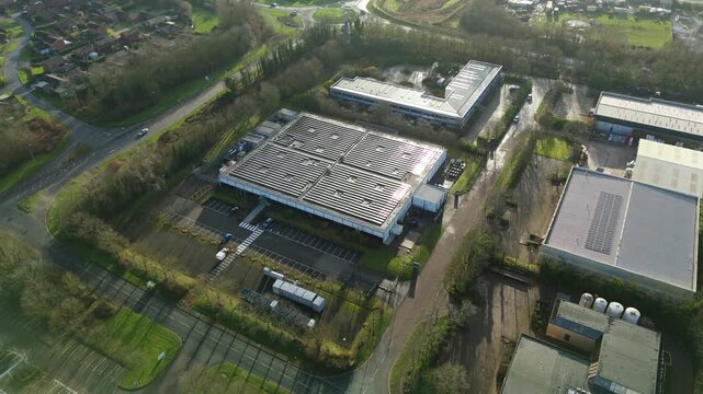 Aerial view of a data center in Milton Keynes, featuring buildings with solar panels and large parking lots, Milton Keynes, England, United Kingdom.