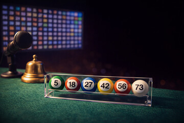 Colorful Bingo Balls on Green Table Surface