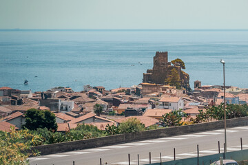 The ruins of the Swabian castle in front of the sea at Aci Castello, Catania province, Sicily, Italy